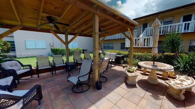 a view of a chairs and table in a patio
