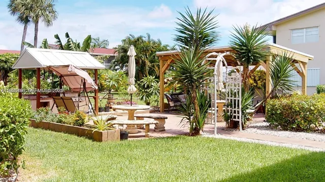 a view of a lake with palm trees