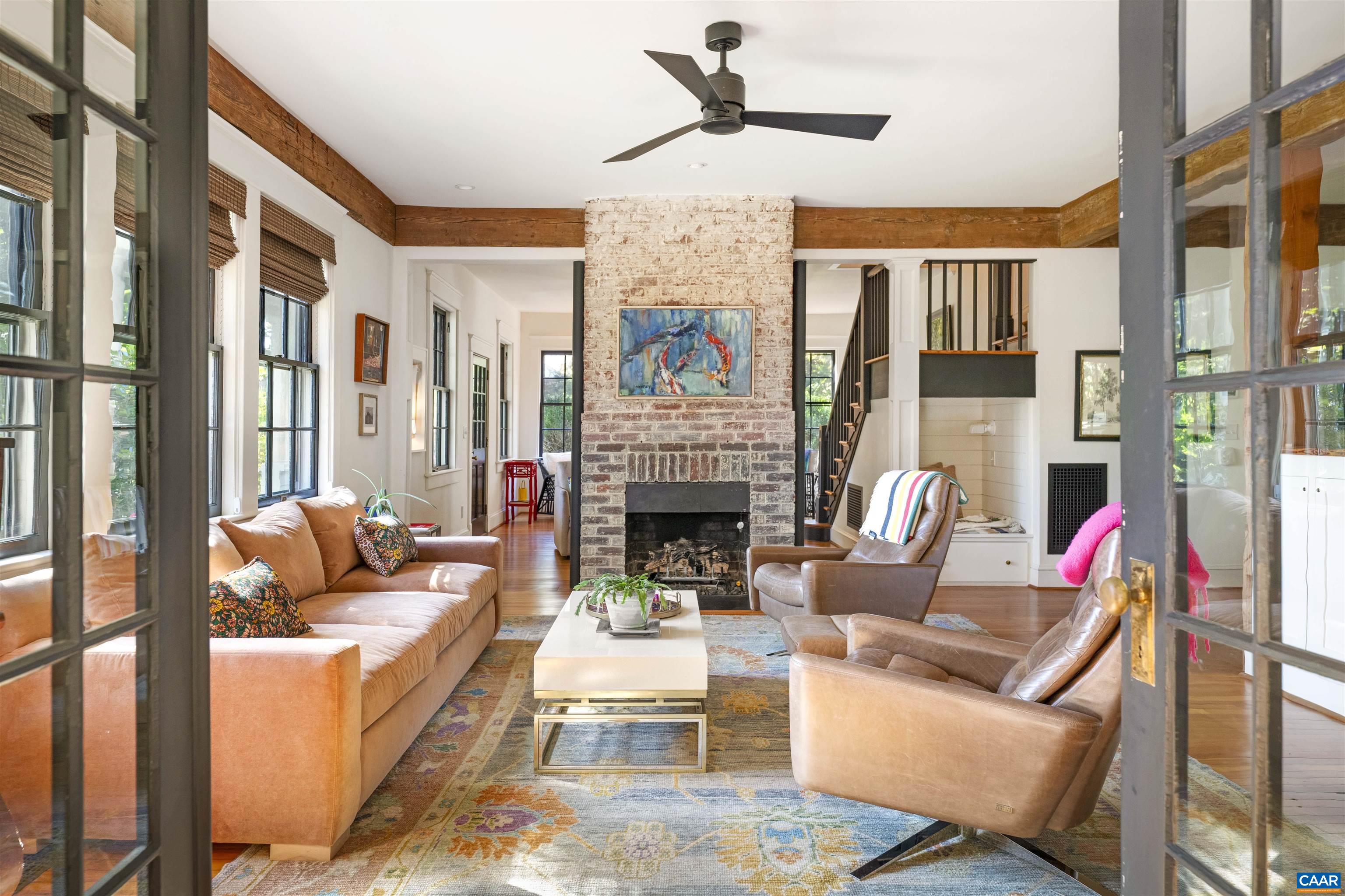 1535 Dairy Road Charlottesville, VA 22903 - Photo 12 of 70 a living room with furniture a fireplace and a large window