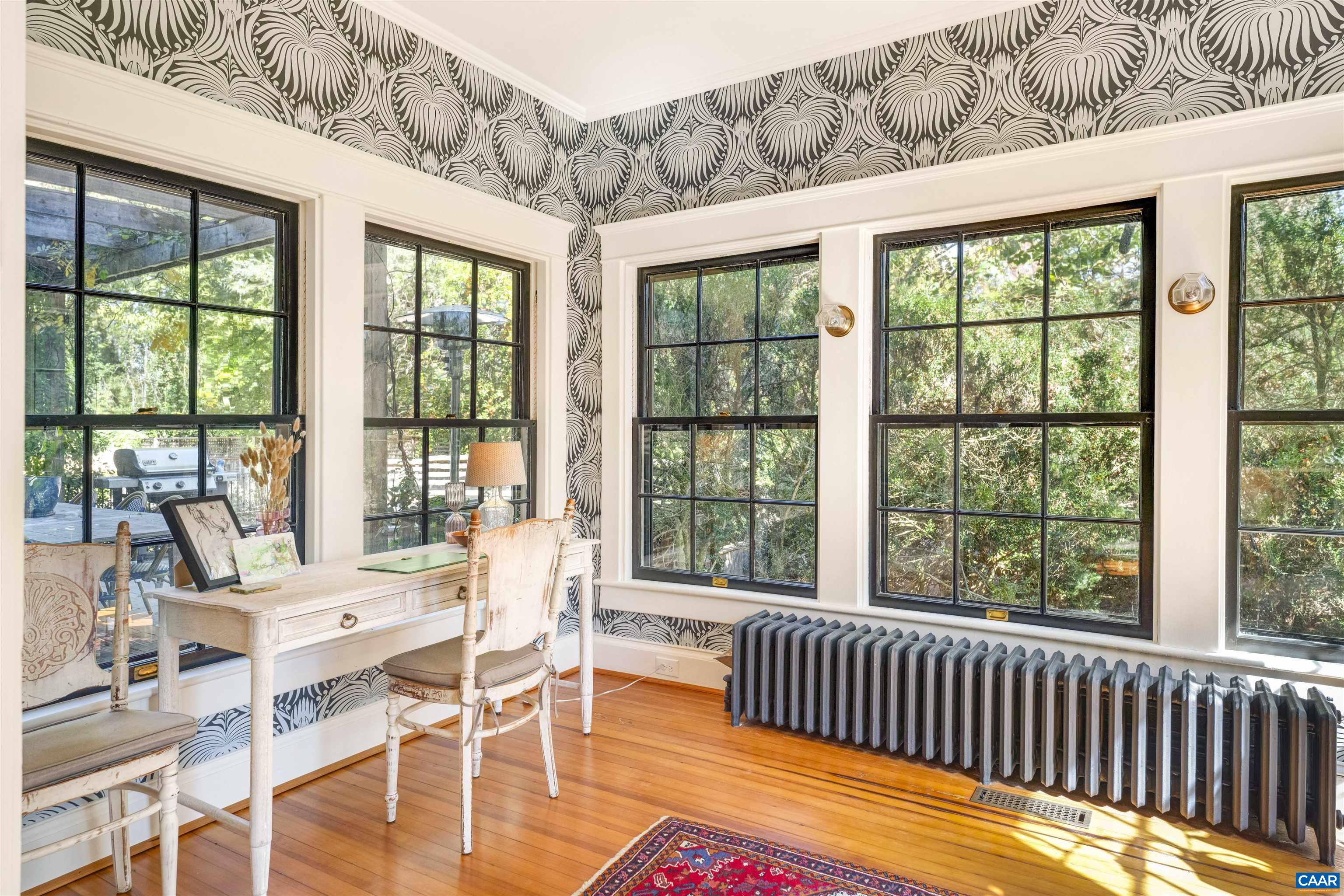 1535 Dairy Road Charlottesville, VA 22903 - Photo 16 of 70 a dining room with wooden floor windows and outdoor view