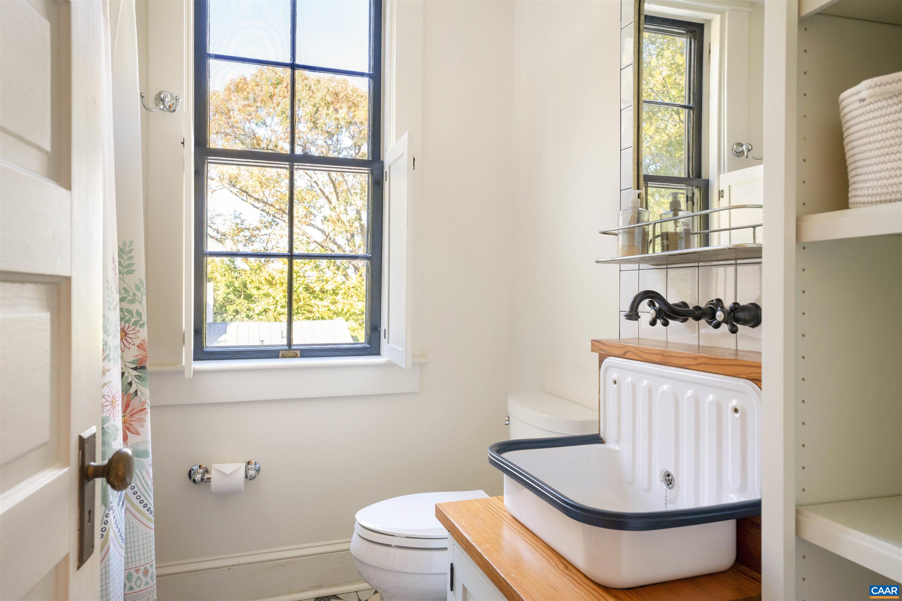 1535 Dairy Road Charlottesville, VA 22903 - Photo 23 of 70 a bathroom with a sink a toilet and a window