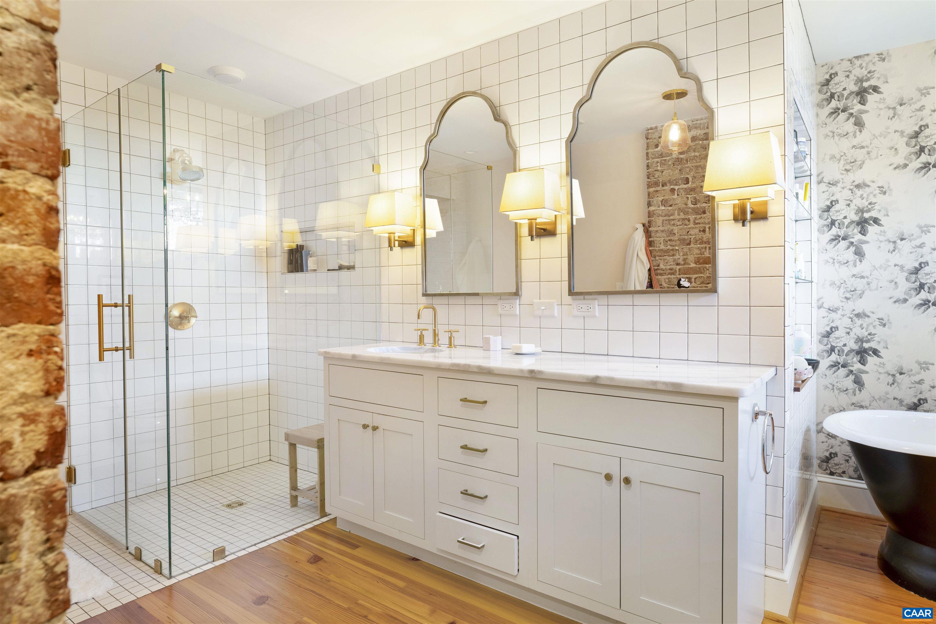 1535 Dairy Road Charlottesville, VA 22903 - Photo 28 of 70 a bathroom with a double vanity sink mirror and shower