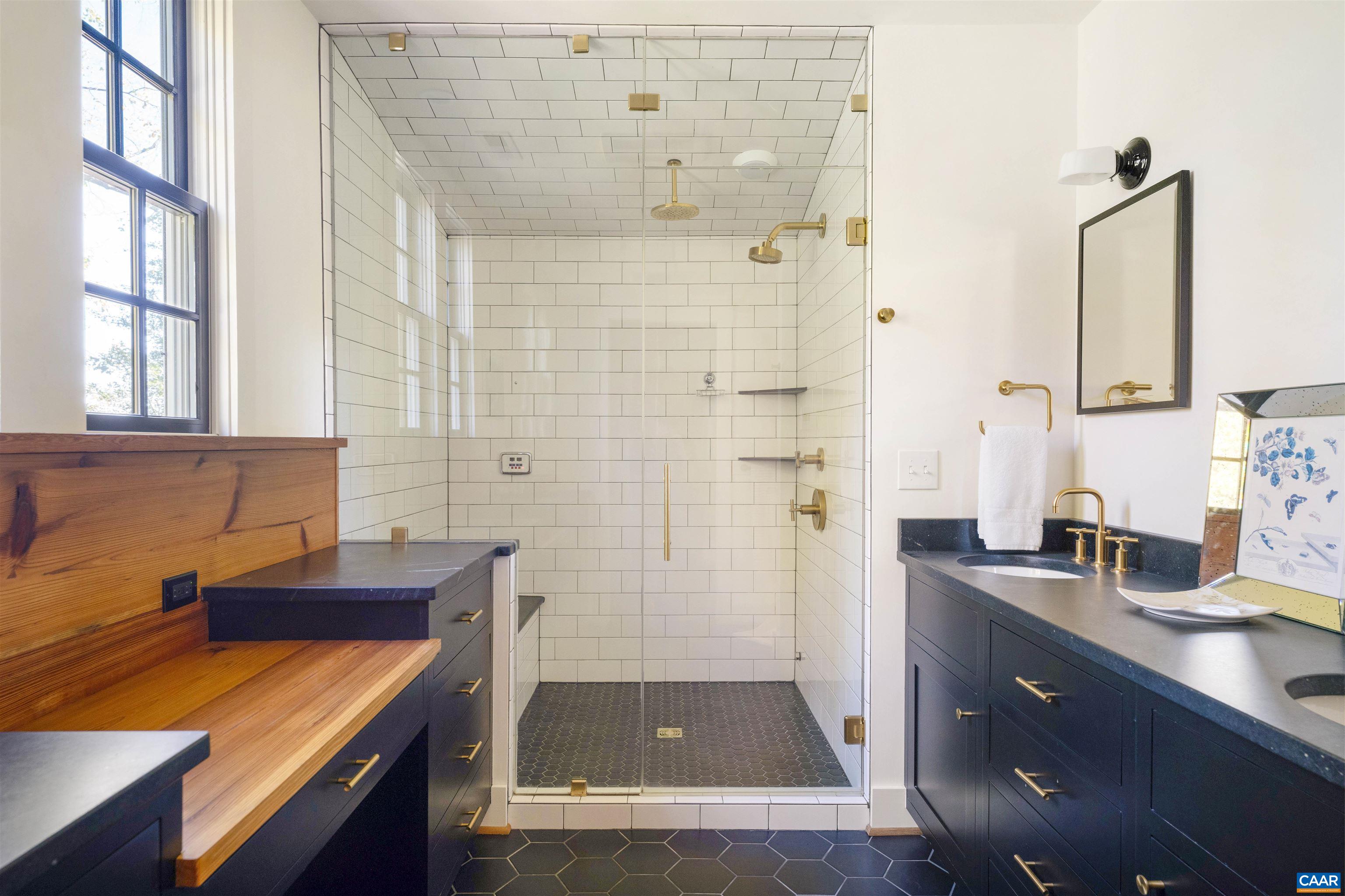 1535 Dairy Road Charlottesville, VA 22903 - Photo 29 of 70 a bathroom with a sink and a mirror