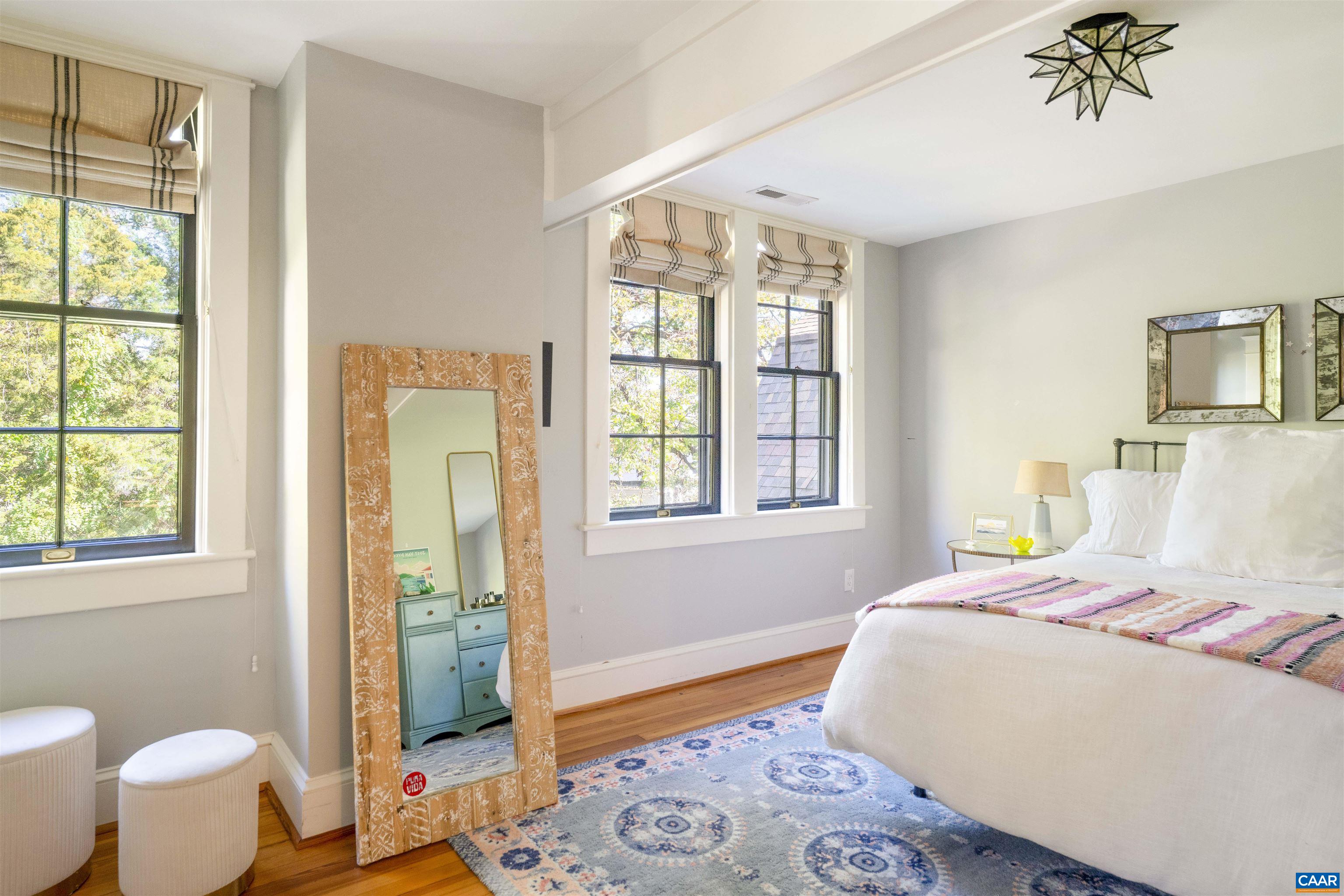 1535 Dairy Road Charlottesville, VA 22903 - Photo 35 of 70 a bedroom with a bed and wooden floor
