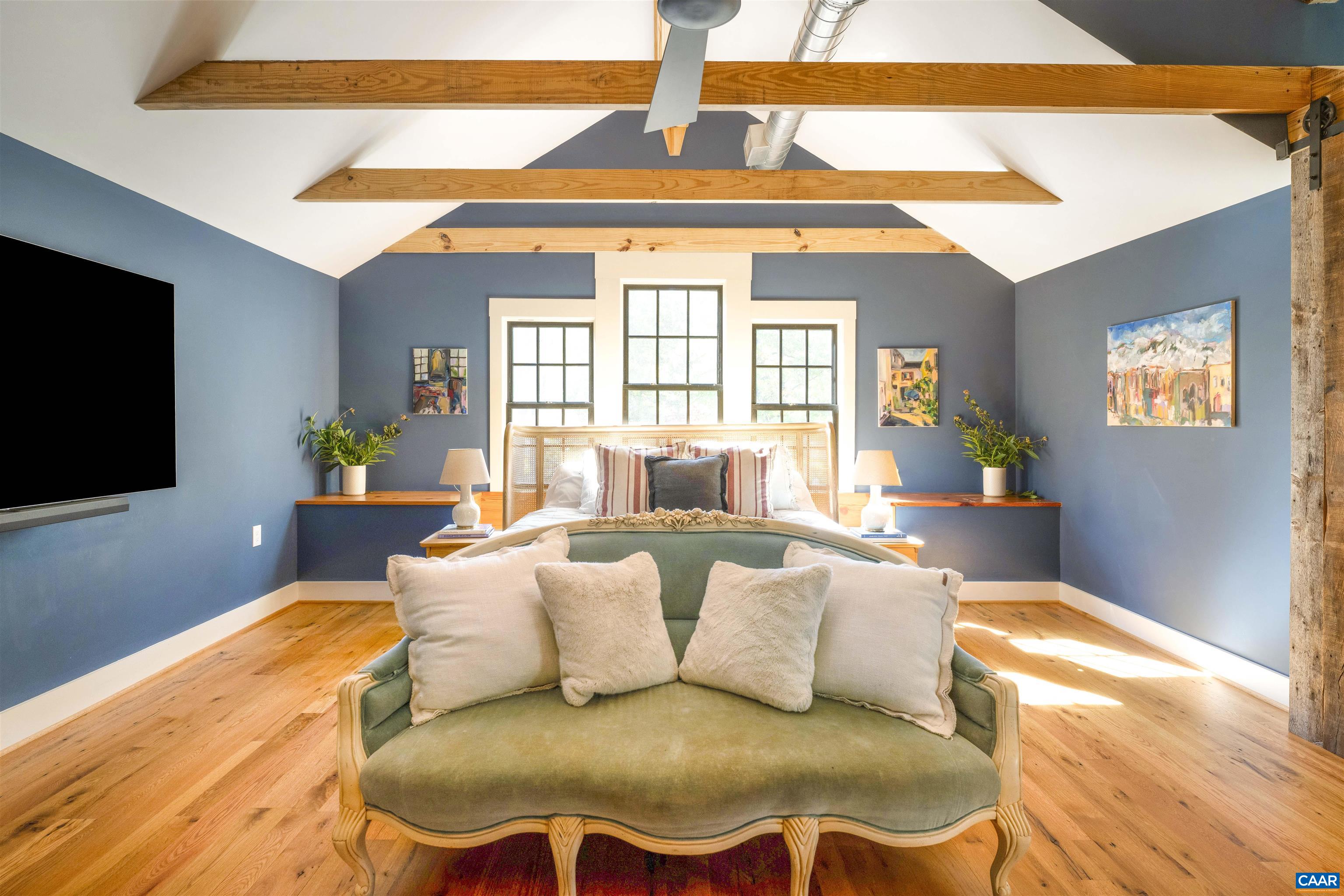 1535 Dairy Road Charlottesville, VA 22903 - Photo 40 of 70 a living room with furniture and a flat screen tv