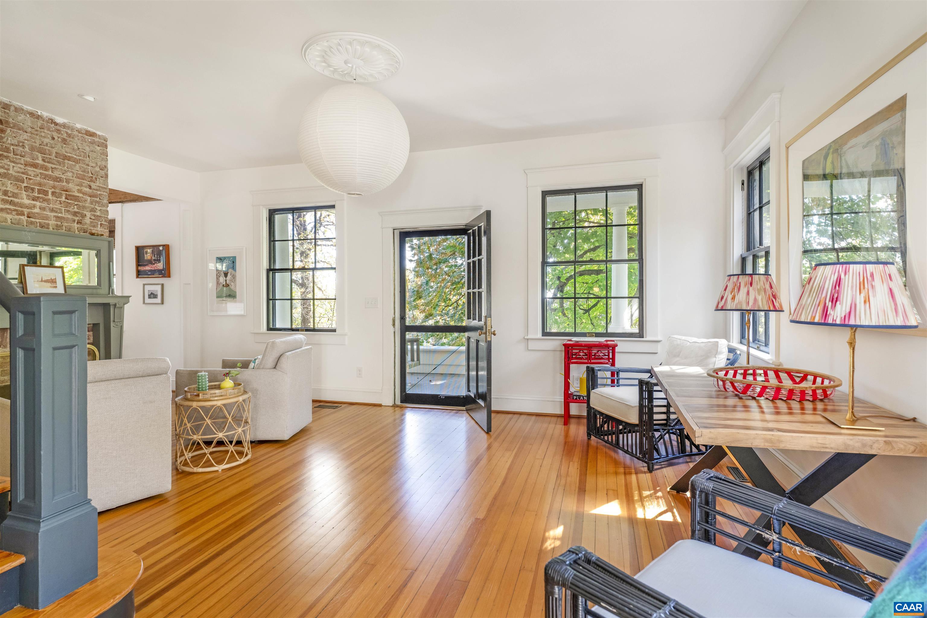 1535 Dairy Road Charlottesville, VA 22903 - Photo 4 of 70 a view of a livingroom with furniture a book and wooden floor