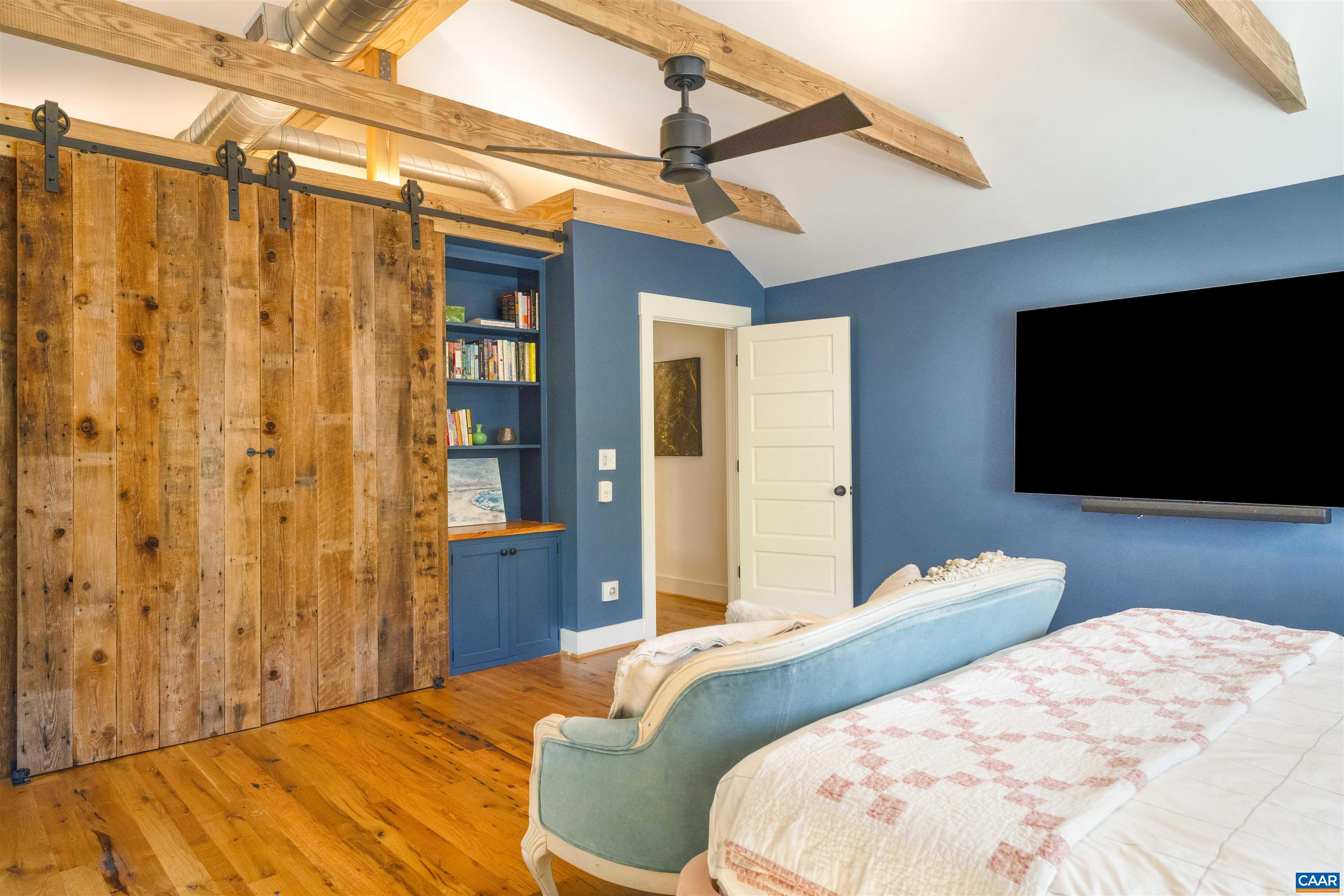 1535 Dairy Road Charlottesville, VA 22903 - Photo 41 of 70 a bedroom with a bed and a flat screen tv