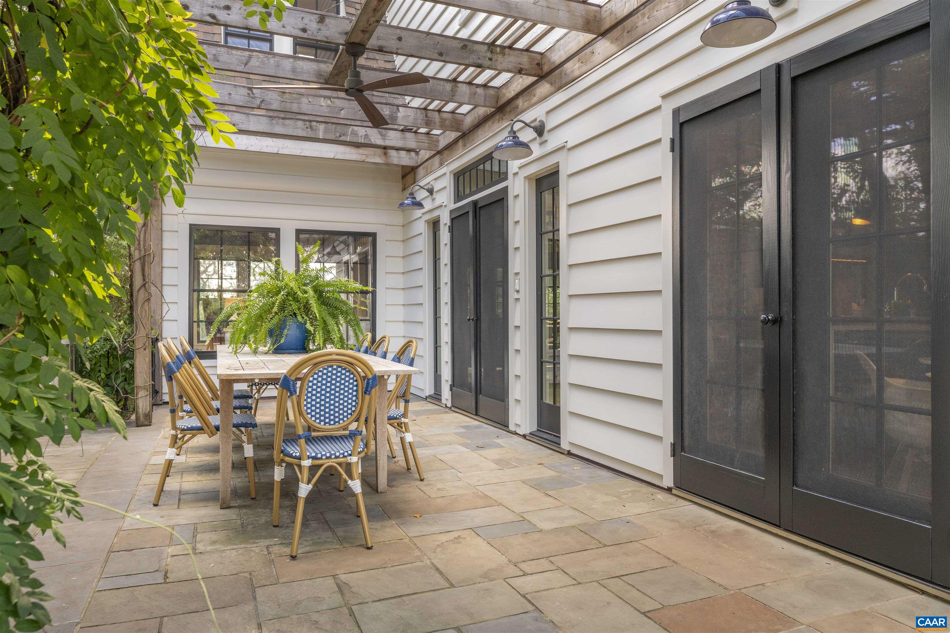 1535 Dairy Road Charlottesville, VA 22903 - Photo 44 of 70 a patio with table and chairs and potted plants