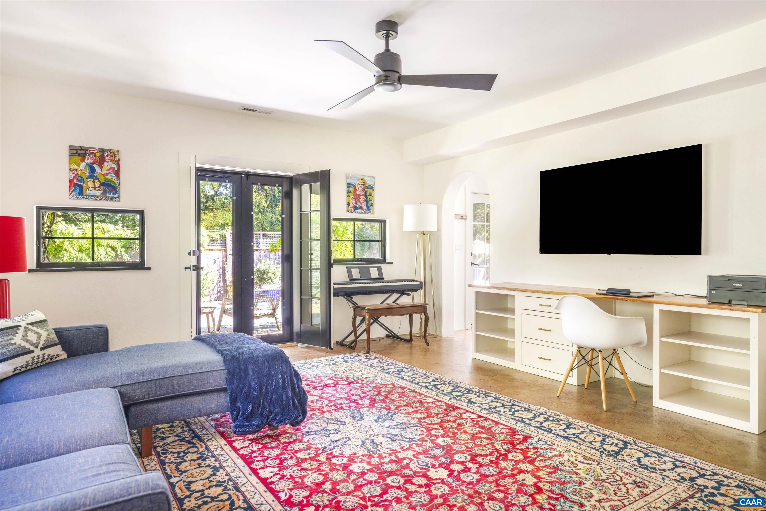 1535 Dairy Road Charlottesville, VA 22903 - Photo 53 of 70 a living room with furniture and a flat screen tv