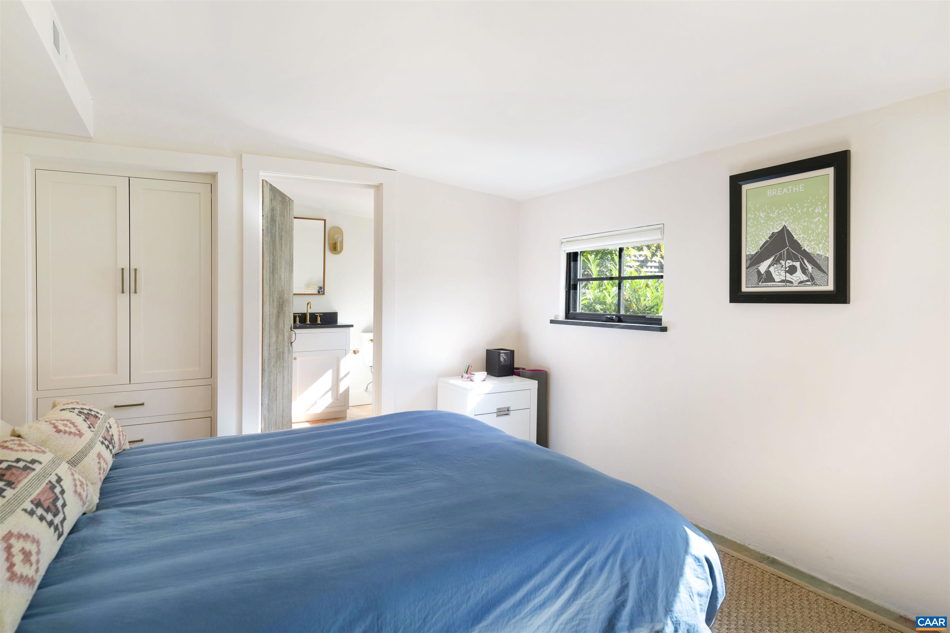 1535 Dairy Road Charlottesville, VA 22903 - Photo 55 of 70 a bedroom with a bed and painting on the wall