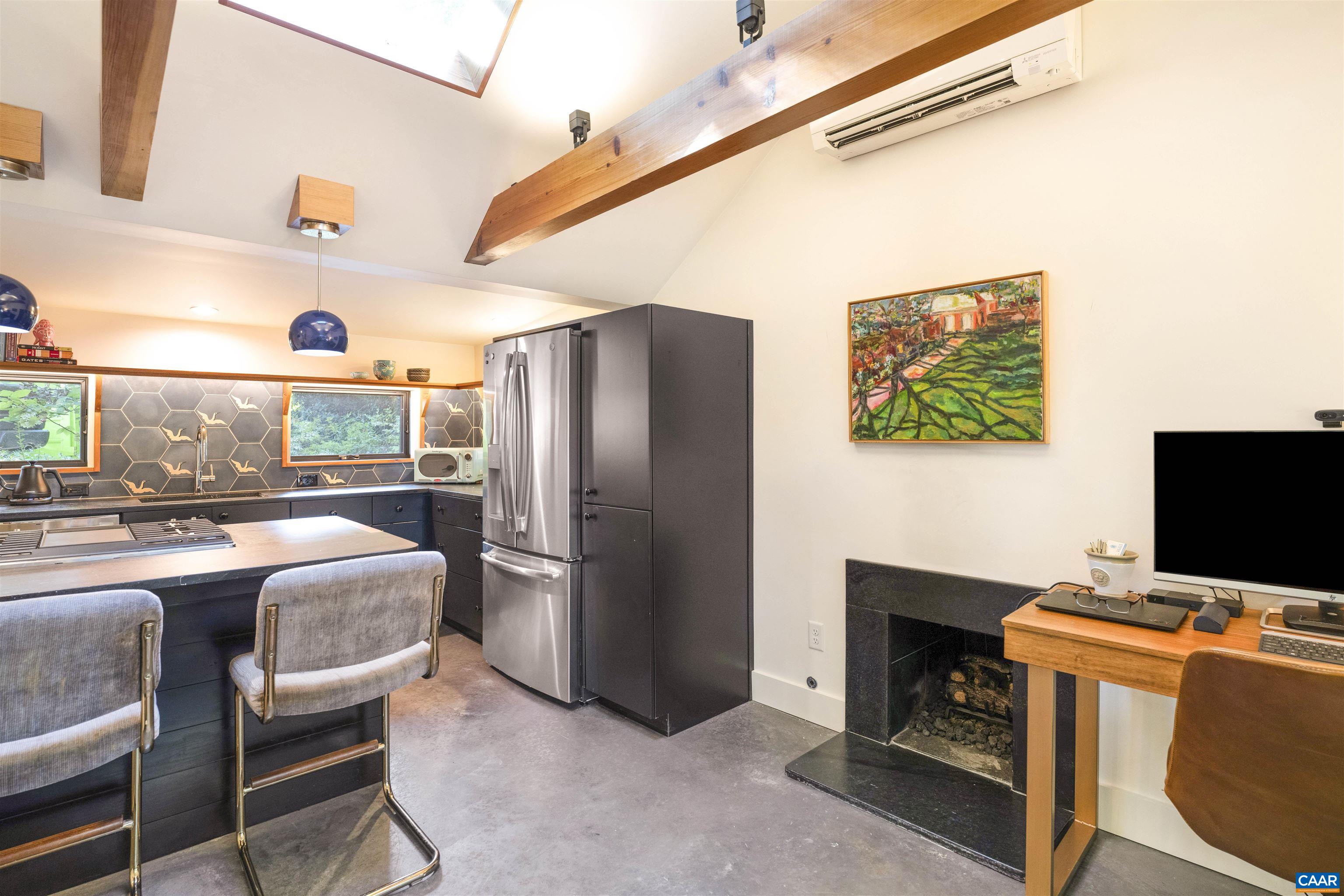 1535 Dairy Road Charlottesville, VA 22903 - Photo 64 of 70 a bedroom with furniture and a fireplace