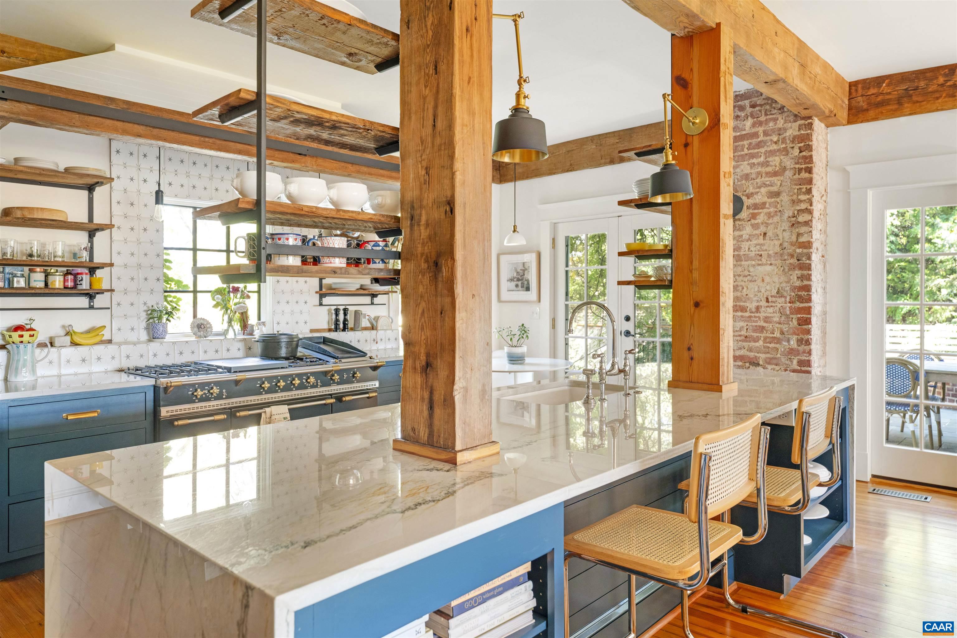 1535 Dairy Road Charlottesville, VA 22903 - Photo 7 of 70 a kitchen with stainless steel appliances granite countertop a stove a sink and white cabinets