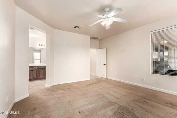 a view of a livingroom with furniture and a window