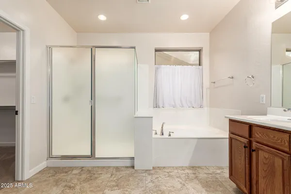 a garden with a bench and some trees