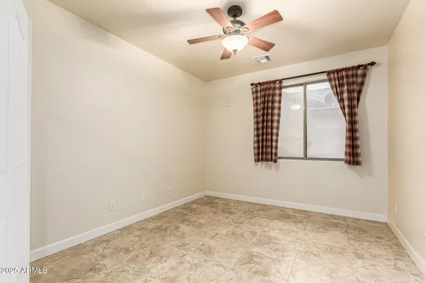 a view of a street with flower plants