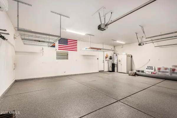 a view of a house with swimming pool and sitting area
