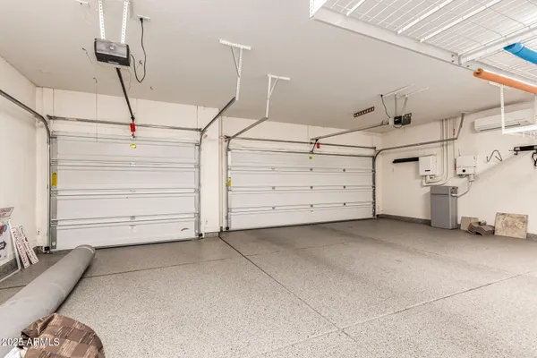 a view of a patio with a table and chairs
