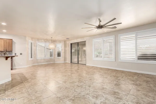 a kitchen with stainless steel appliances granite countertop a stove top oven a sink and a refrigerator