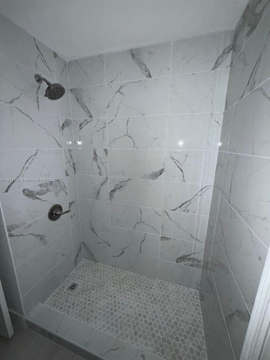 790 Sorrento Drive, Unit 790 Weston, FL 33326 - Photo 5 of 5 a bathroom with a shower