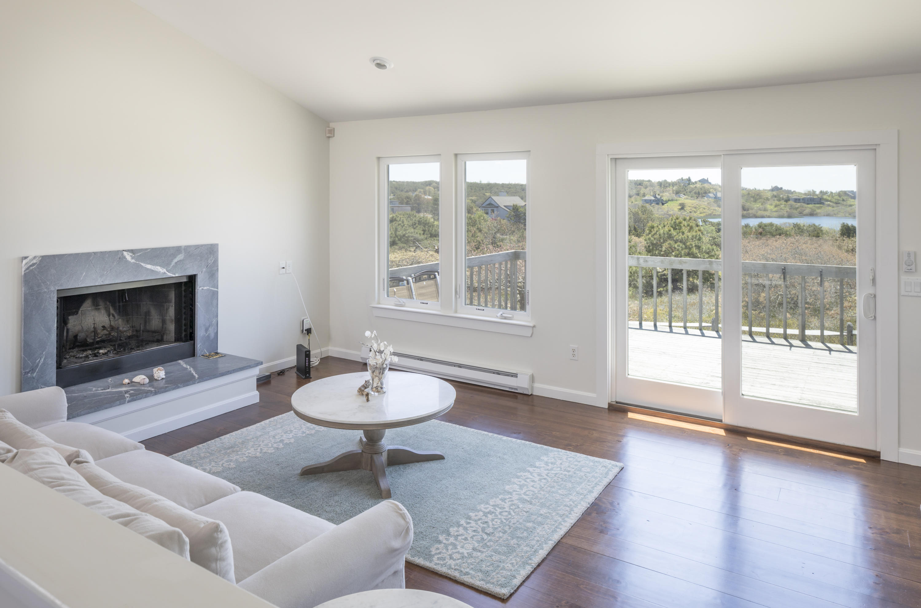8 Avocet Road Truro, MA 02666 - Photo 3 of 4 a living room with furniture and a fireplace