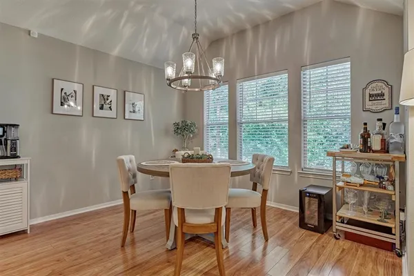 a view of a dining room with furniture window and wooden floor