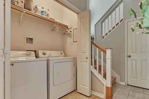 a view of storage and utility room with washer and dryer
