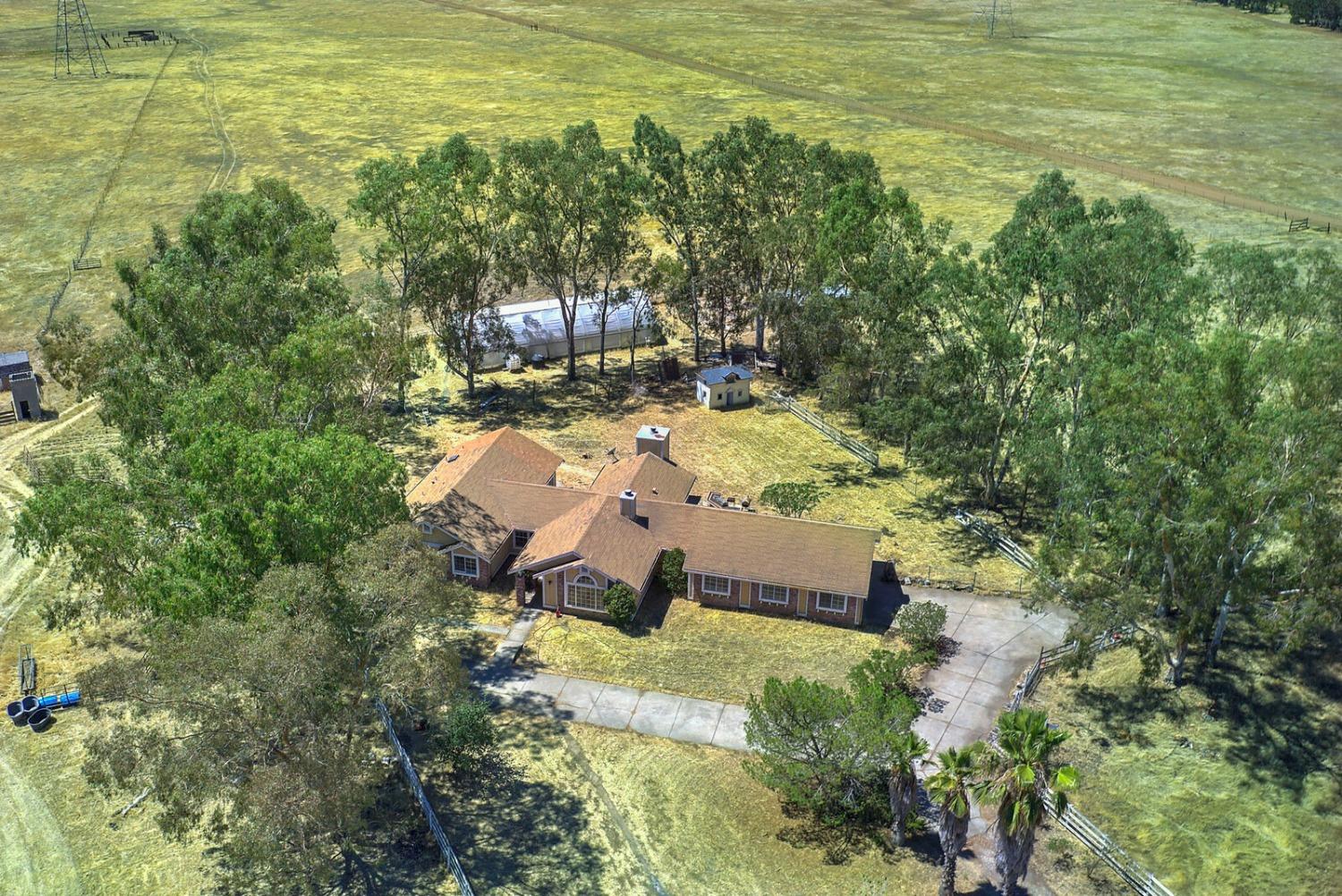 a view of a yard with an outdoor seating