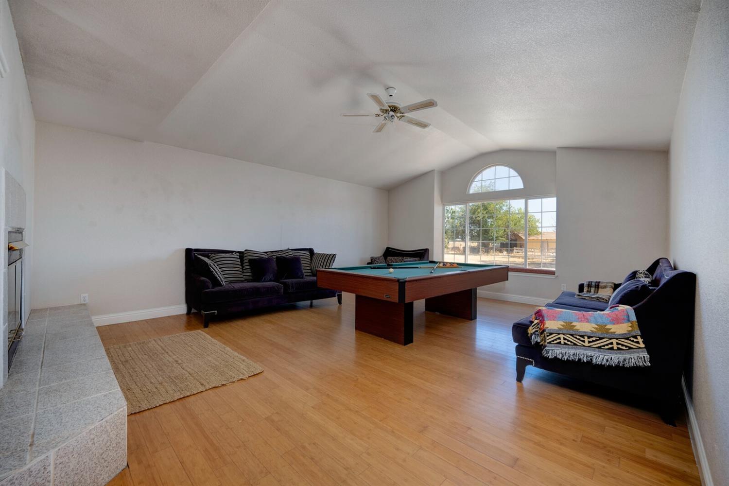 4427 East Catlett Road Lincoln, CA 95648 - Photo 13 of 51 a living room with furniture and a wooden floor