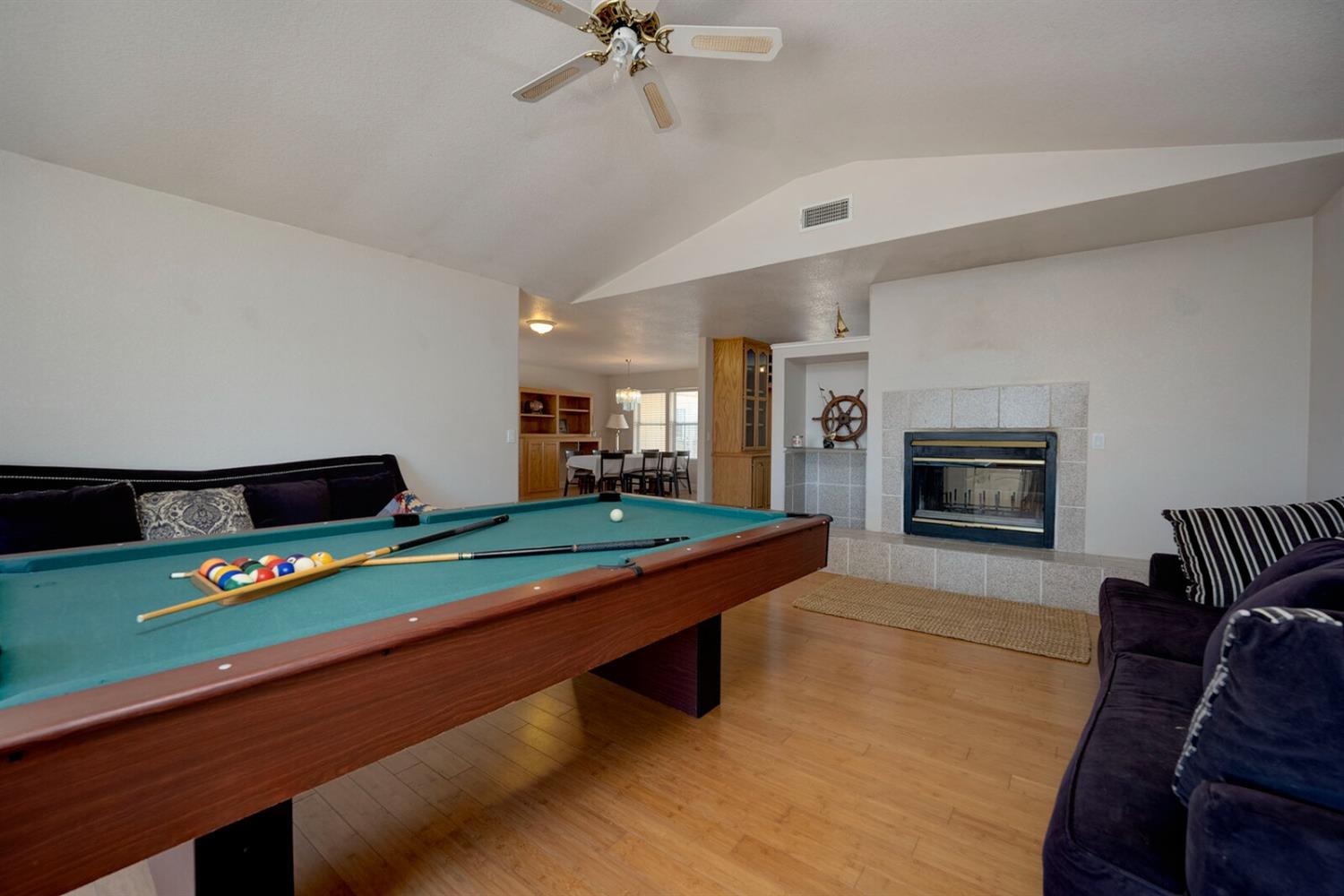 4427 East Catlett Road Lincoln, CA 95648 - Photo 15 of 51 a room with furniture and a flat screen tv