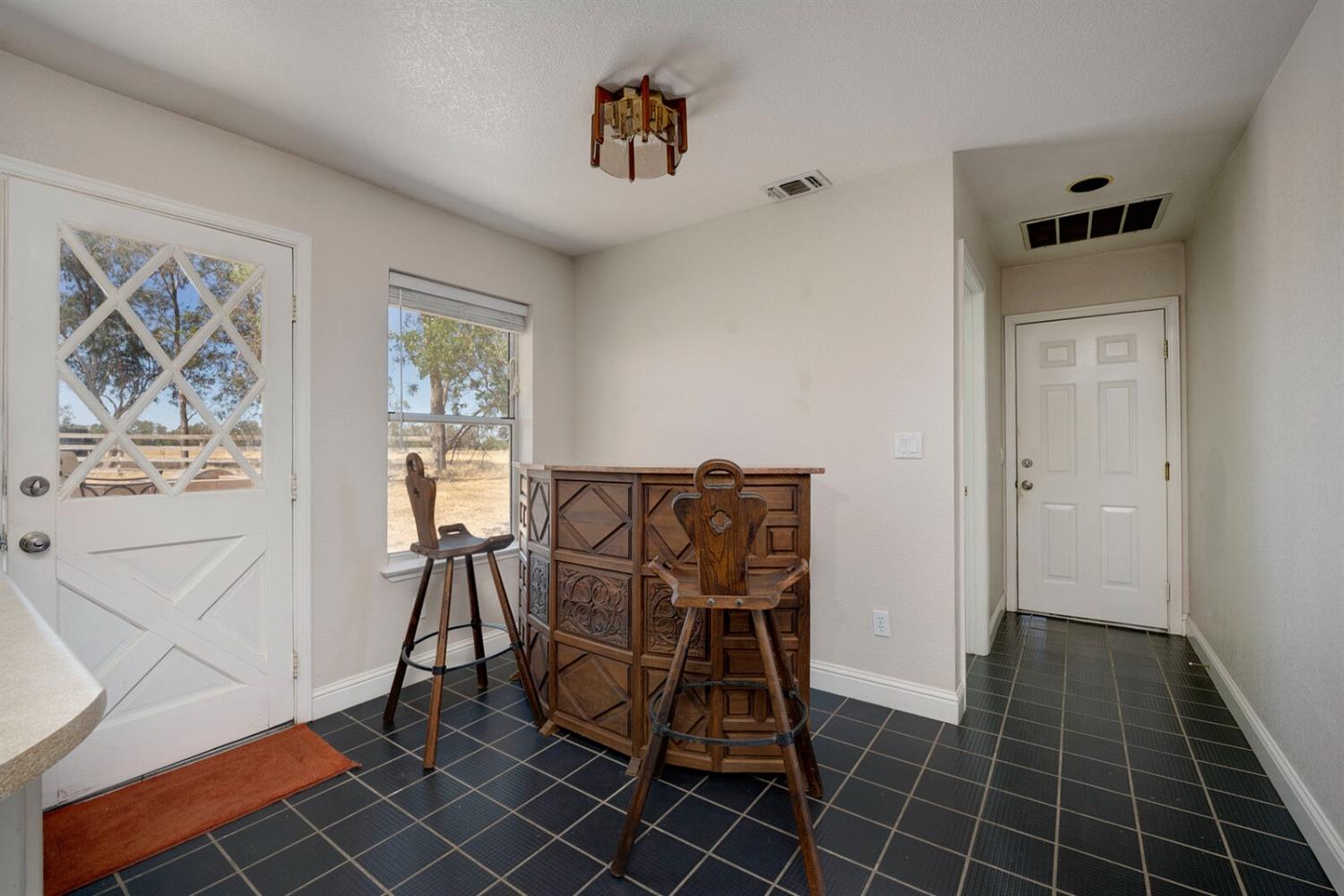 4427 East Catlett Road Lincoln, CA 95648 - Photo 24 of 51 a view of a workspace with furniture and a window
