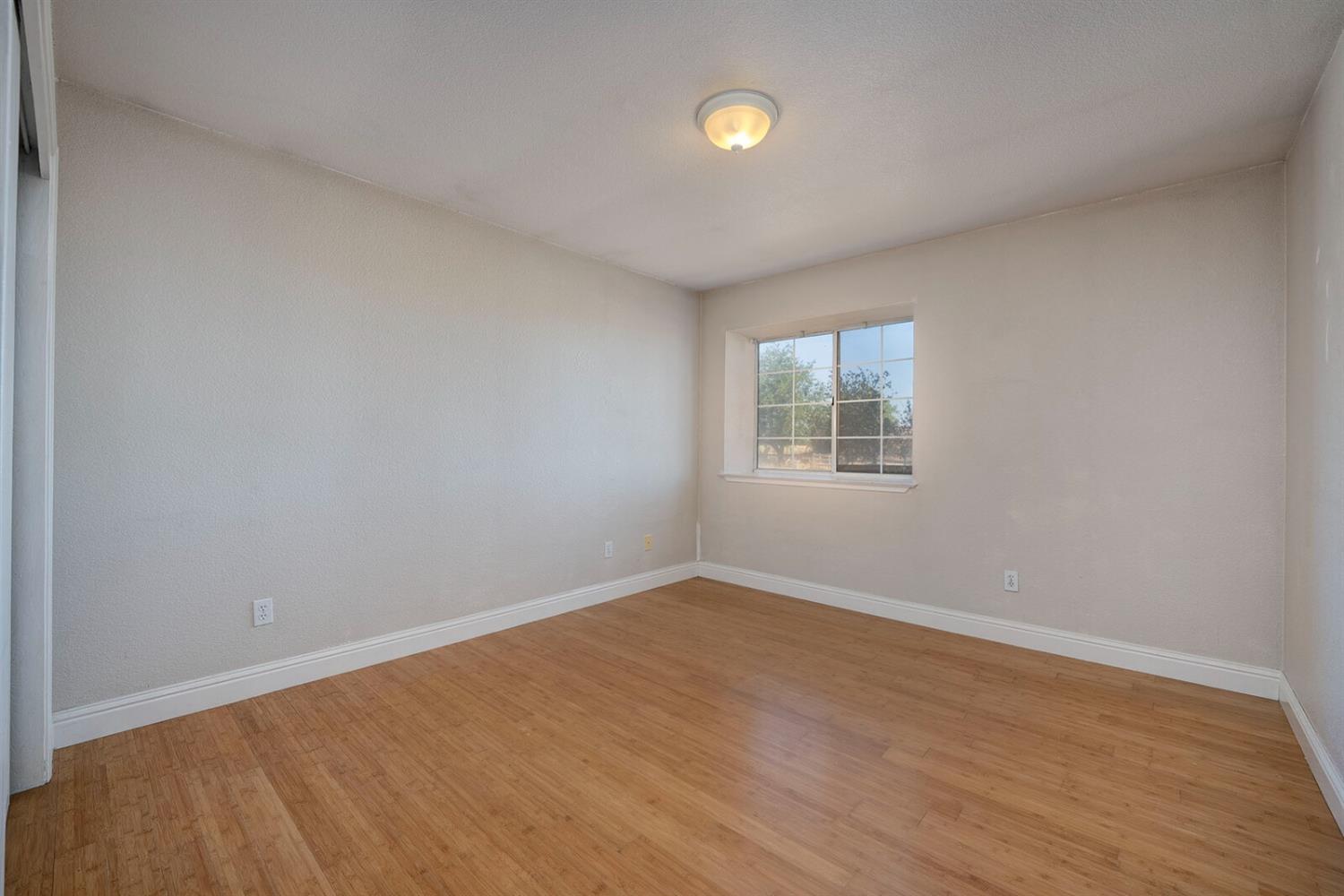4427 East Catlett Road Lincoln, CA 95648 - Photo 27 of 51 an empty room with a window