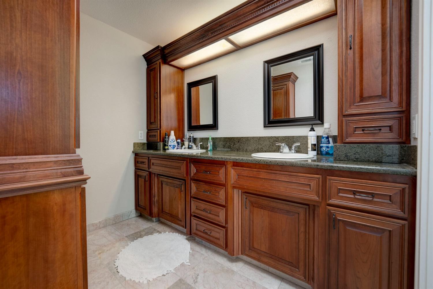 4427 East Catlett Road Lincoln, CA 95648 - Photo 33 of 51 a bathroom with a sink and a mirror