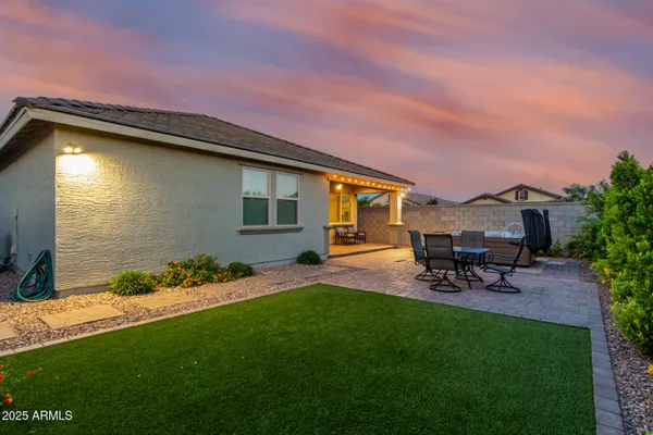 a view of a backyard with sitting area