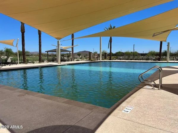 a view of a swimming pool with chairs