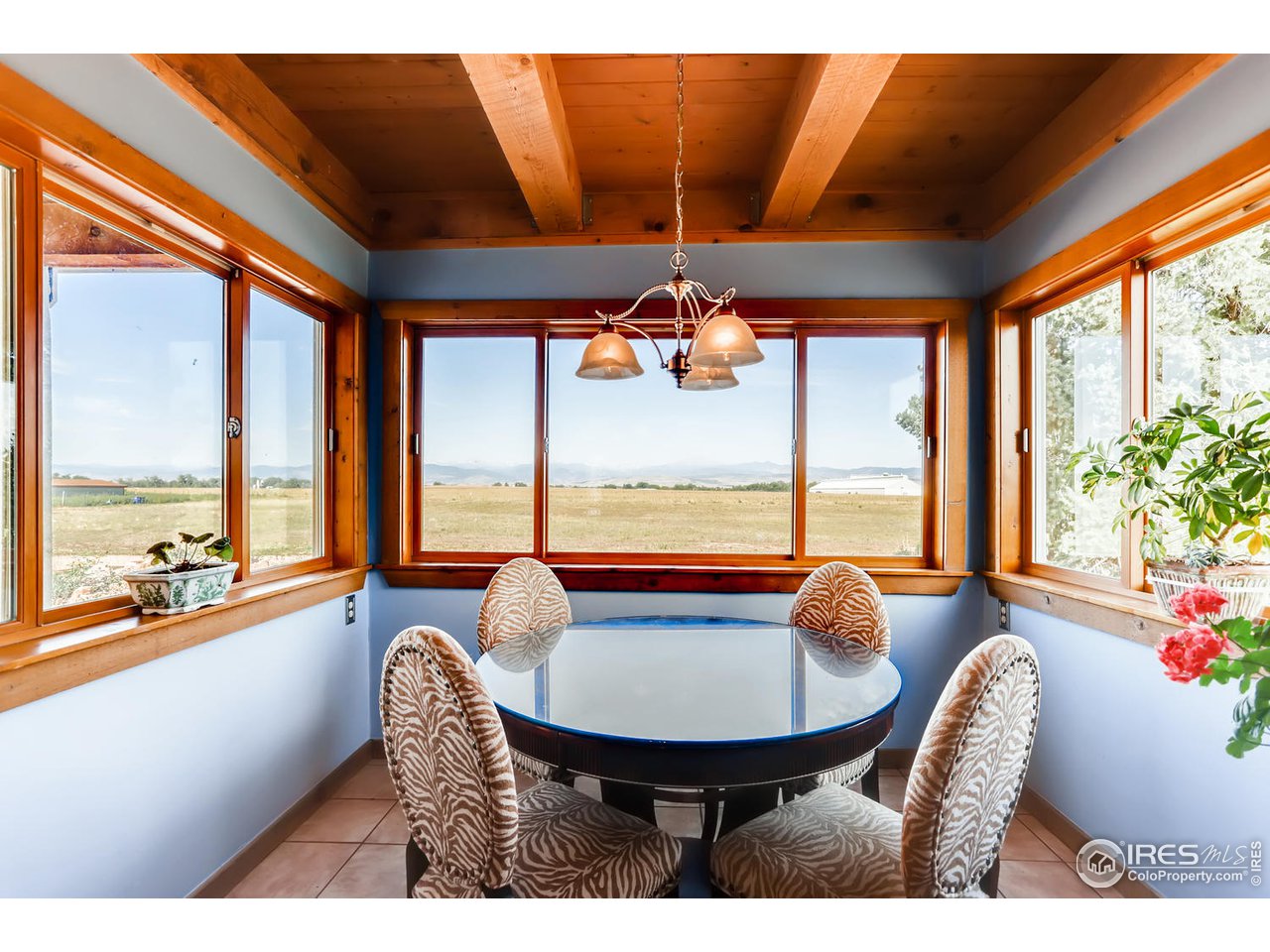 11840 Wasatch Road Longmont, CO 80504 - Photo 13 of 38 a balcony with furniture and outdoor view