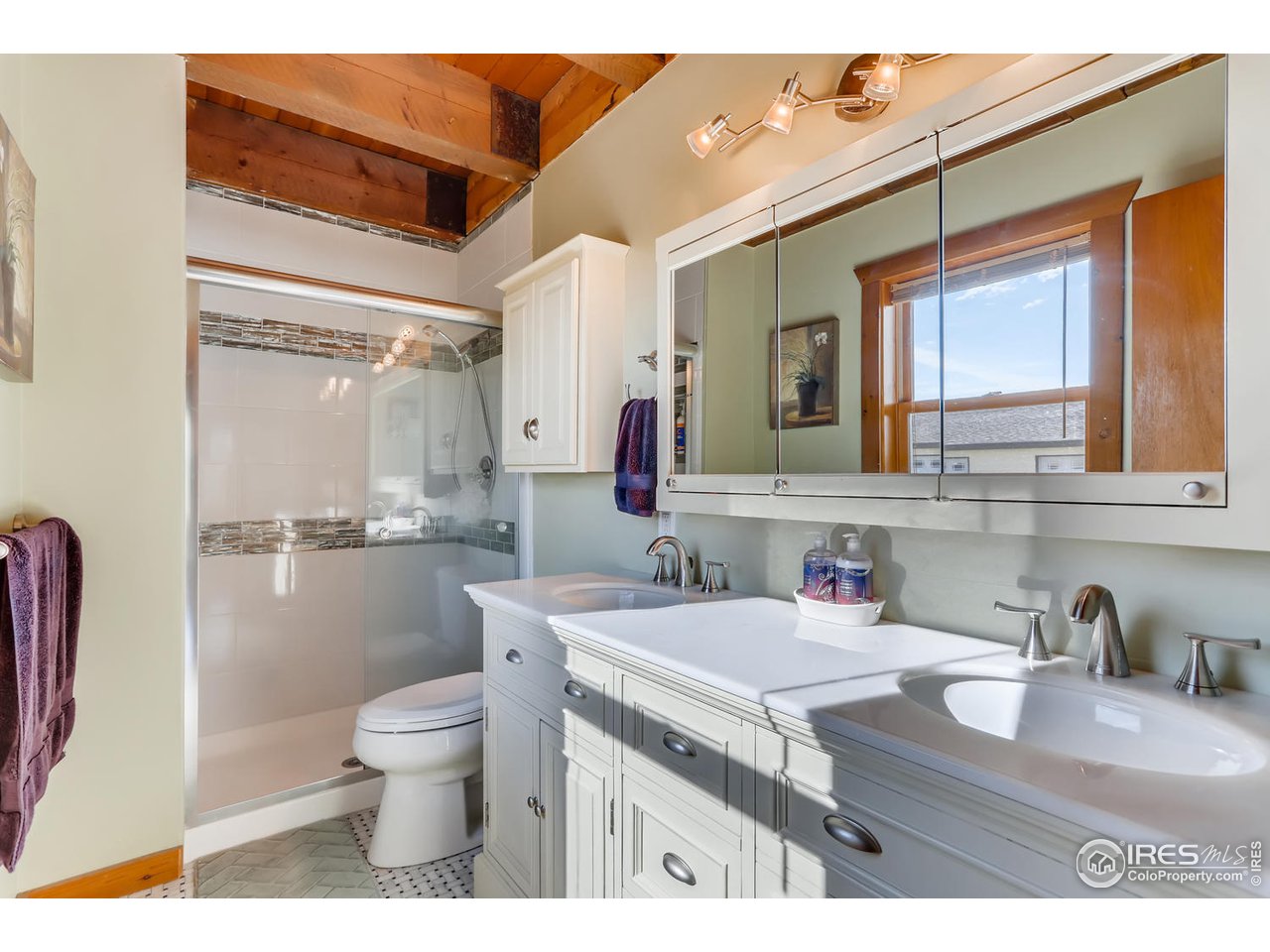 11840 Wasatch Road Longmont, CO 80504 - Photo 17 of 38 a bathroom with a sink toilet and mirror
