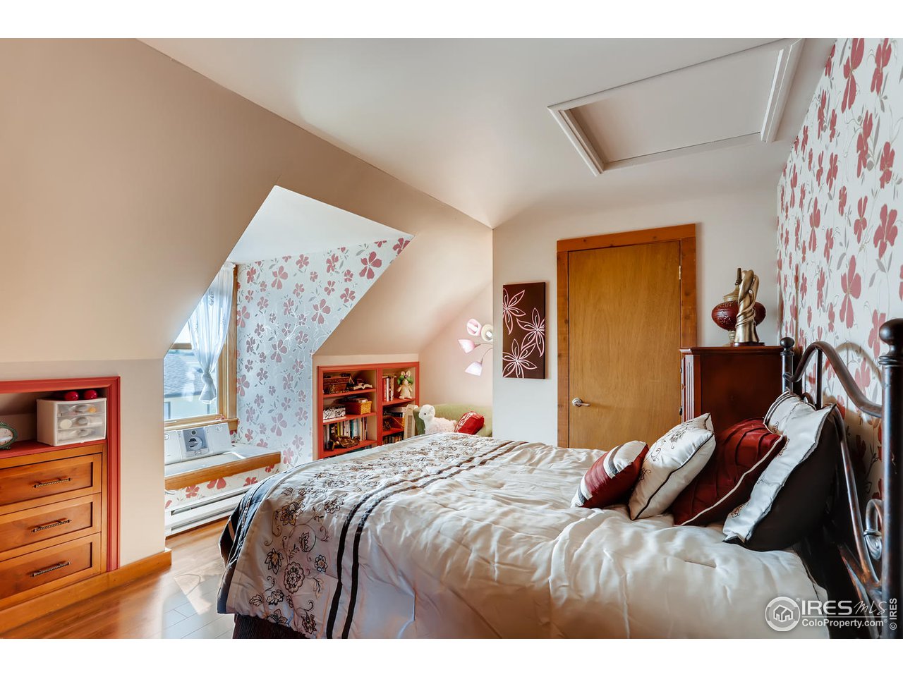 11840 Wasatch Road Longmont, CO 80504 - Photo 21 of 38 a bedroom with a bed and a flat screen tv
