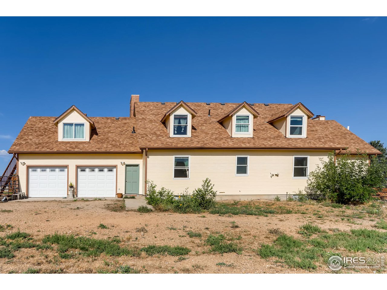 11840 Wasatch Road Longmont, CO 80504 - Photo 30 of 38 a front view of a house with a yard