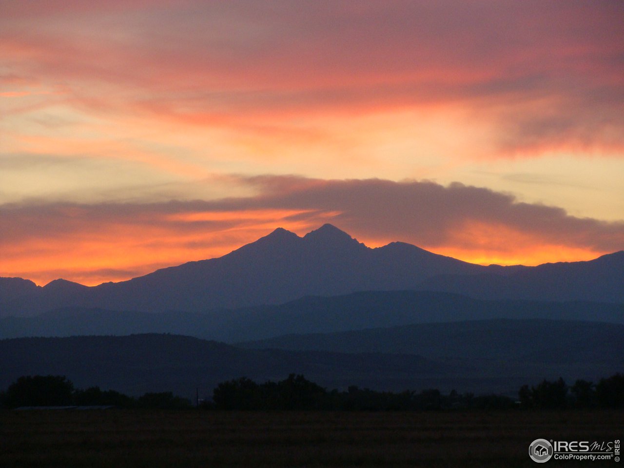 11840 Wasatch Road Longmont, CO 80504 - Photo 37 of 38 a view of an mountain and sunset