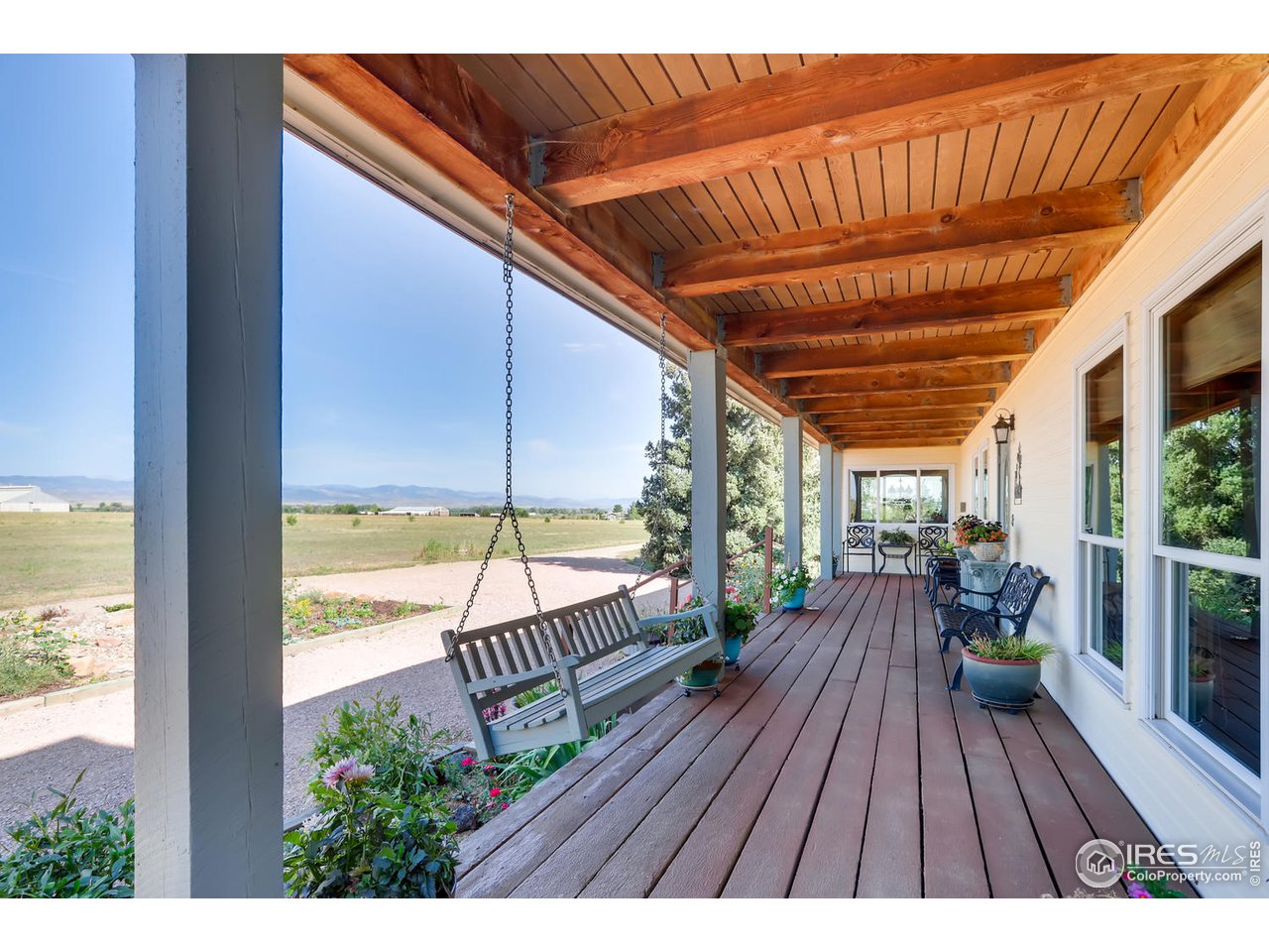 11840 Wasatch Road Longmont, CO 80504 - Photo 5 of 38 a view of a balcony with wooden floor
