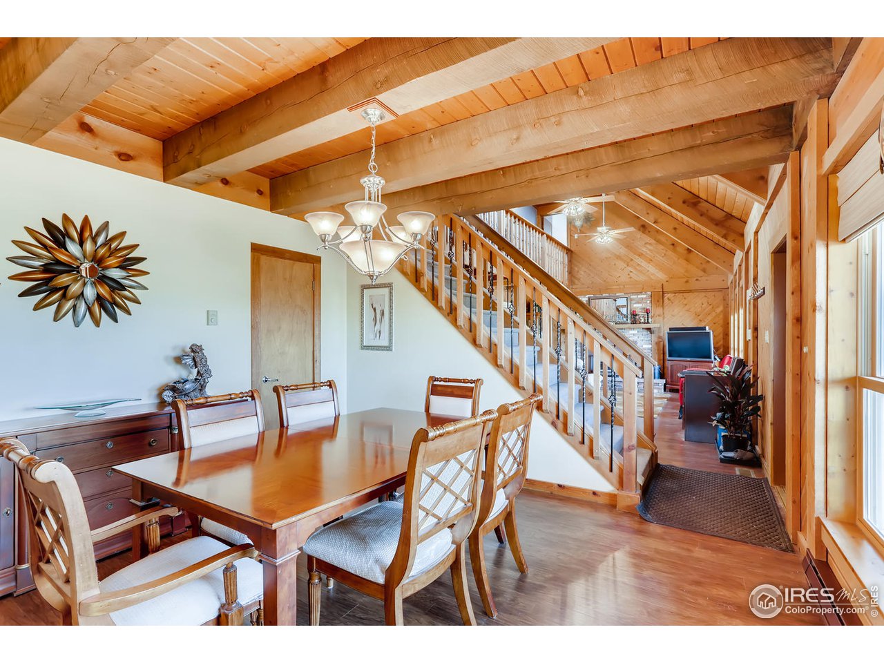 11840 Wasatch Road Longmont, CO 80504 - Photo 8 of 38 a dining room with furniture and wooden floor