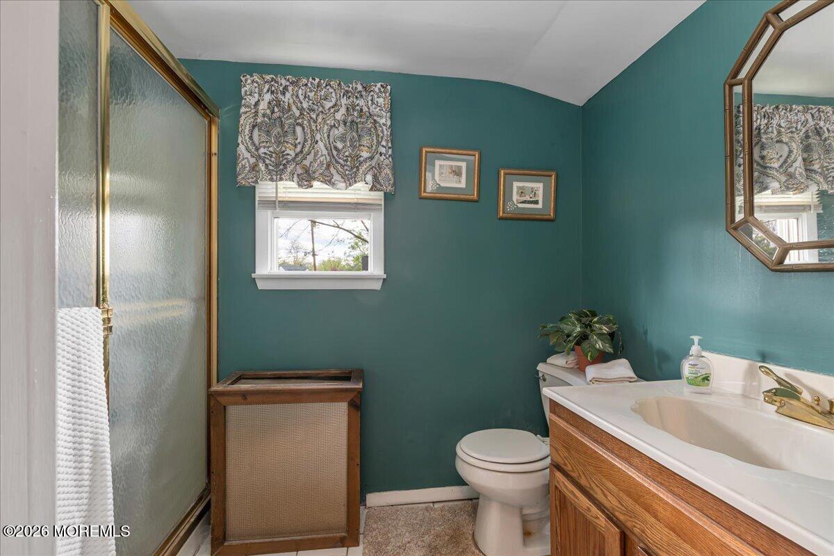 225 Freeman Street Woodbridge, NJ 07095 - Photo 14 of 39 a white toilet sitting next to a bathroom sink