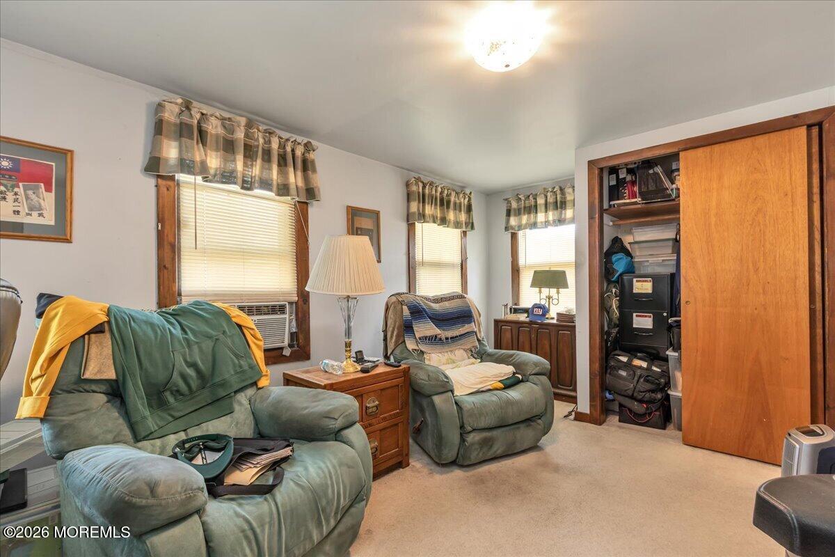 225 Freeman Street Woodbridge, NJ 07095 - Photo 15 of 39 a living room with furniture and a window