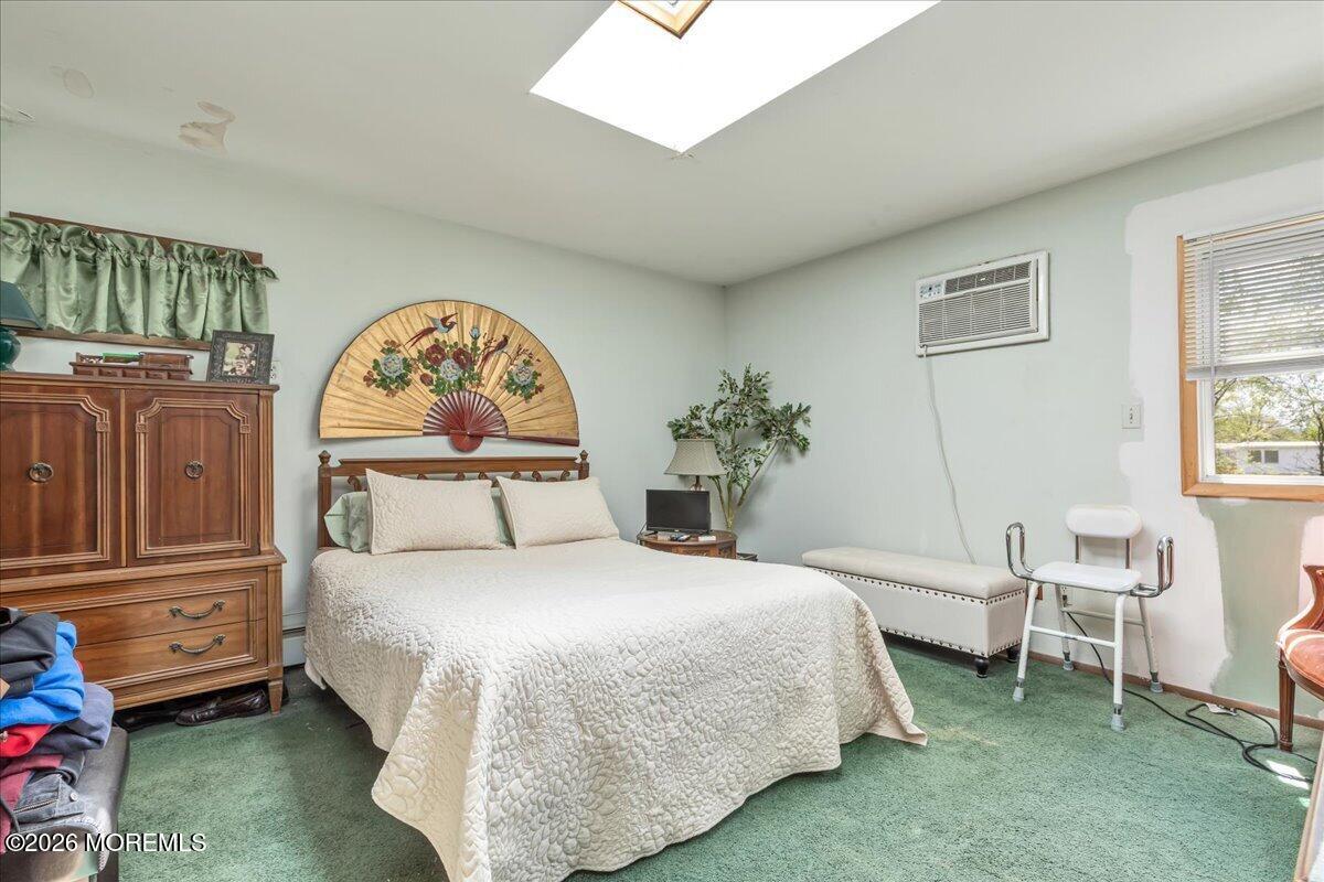 225 Freeman Street Woodbridge, NJ 07095 - Photo 17 of 39 a bedroom with a bed and a window