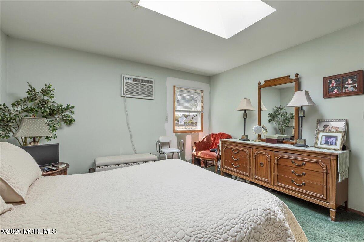 225 Freeman Street Woodbridge, NJ 07095 - Photo 18 of 39 a bedroom with a bed and a dresser in it