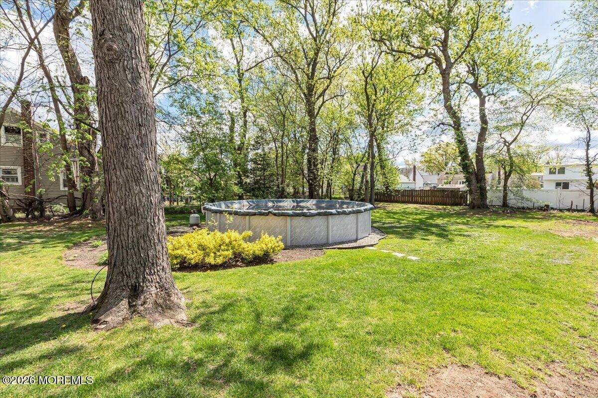 225 Freeman Street Woodbridge, NJ 07095 - Photo 27 of 39 a view of a backyard with large trees