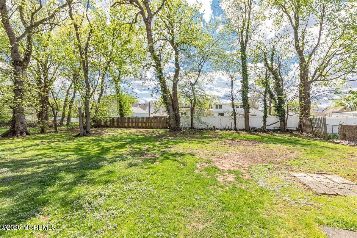 225 Freeman Street Woodbridge, NJ 07095 - Photo 28 of 39 a view of a yard with palm trees