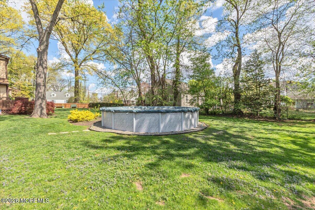 225 Freeman Street Woodbridge, NJ 07095 - Photo 29 of 39 a view of a backyard with large trees