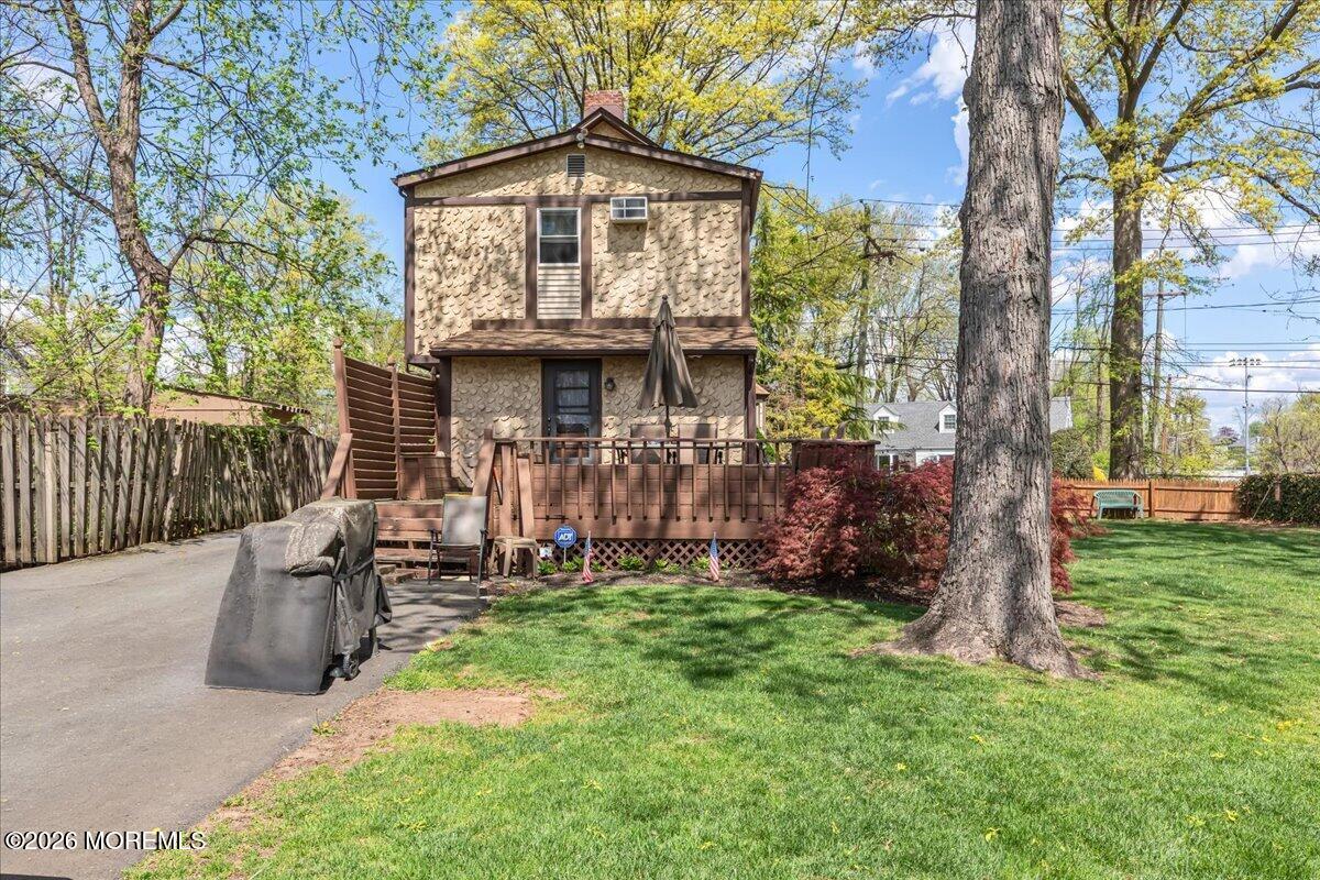 225 Freeman Street Woodbridge, NJ 07095 - Photo 30 of 39 a front view of a house with garden