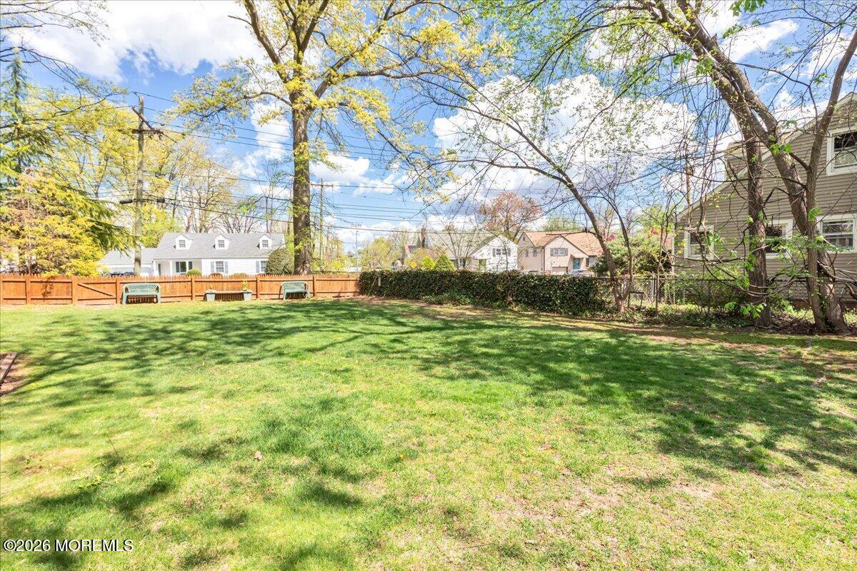225 Freeman Street Woodbridge, NJ 07095 - Photo 34 of 39 a backyard of apartments with large trees